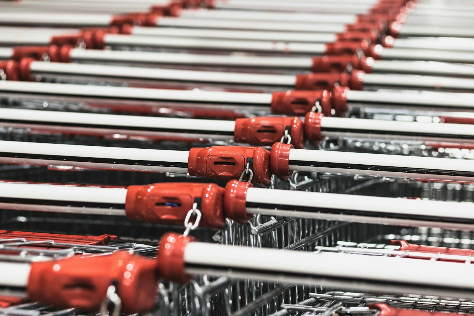 Empty shopping carts at grocery store - save money on groceries