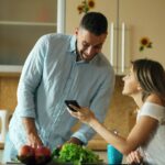 Couple using phone together - fix your relationship